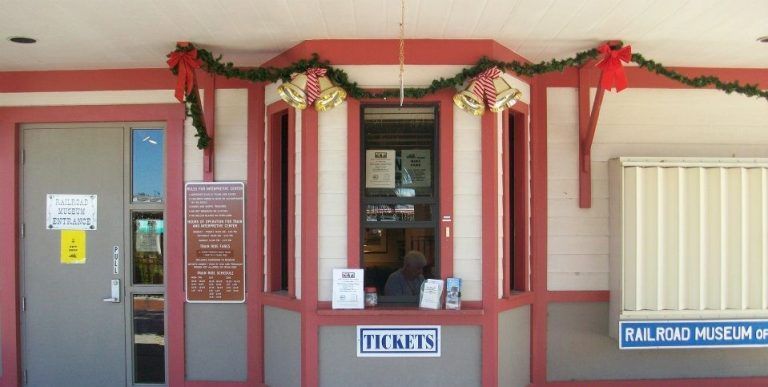 The front of a building with a sign that says tickets