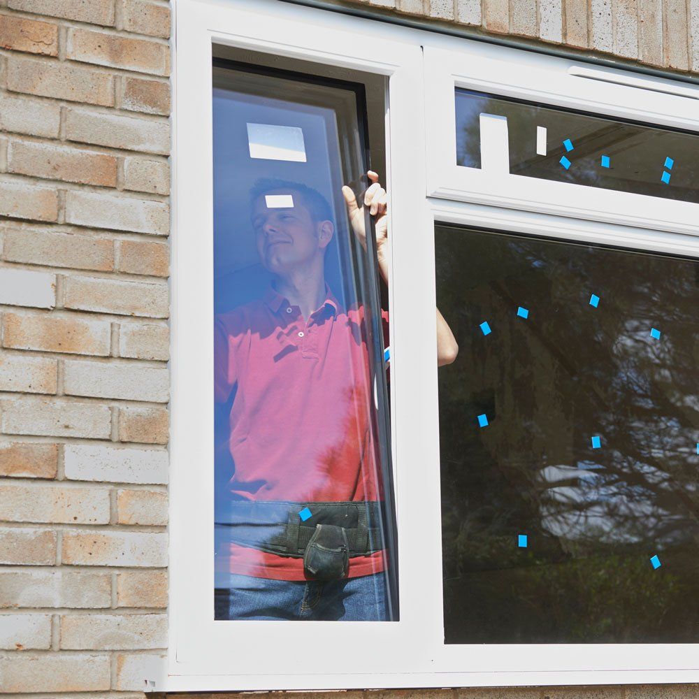 Man Replacing Glass Window — Mansfield, OH — All Glass Systems