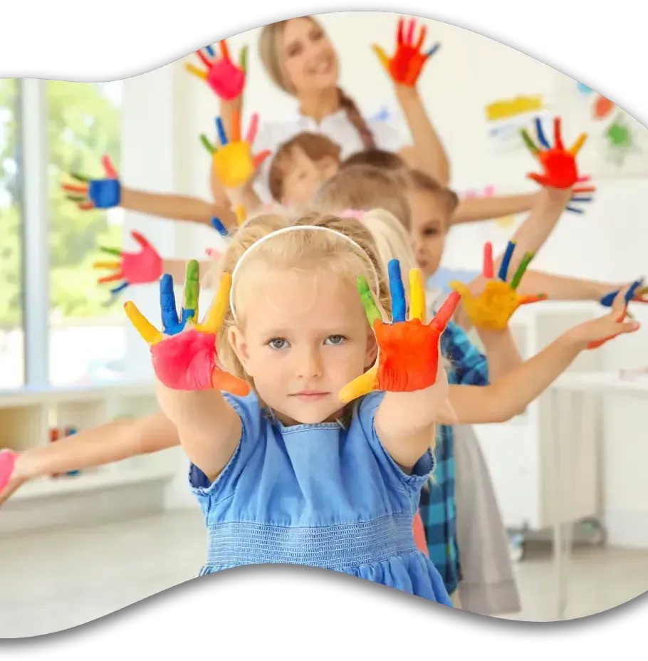 A group of children with their hands painted in different colors.