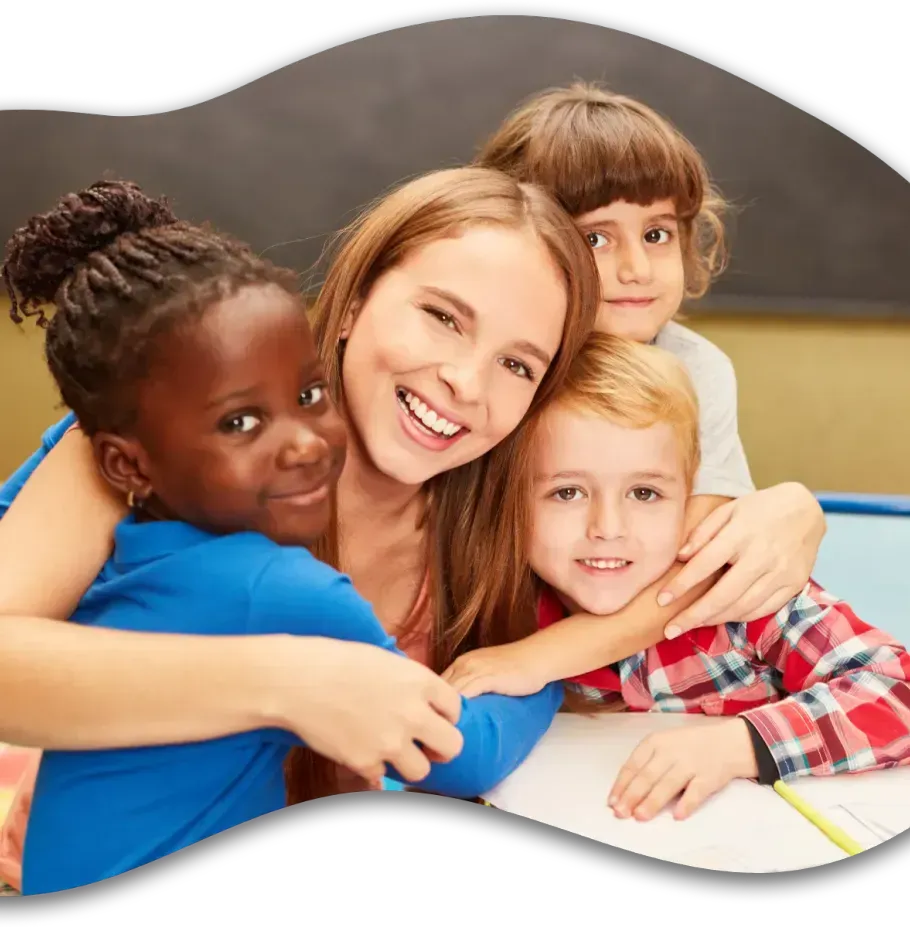 A group of children are hugging each other in a classroom.