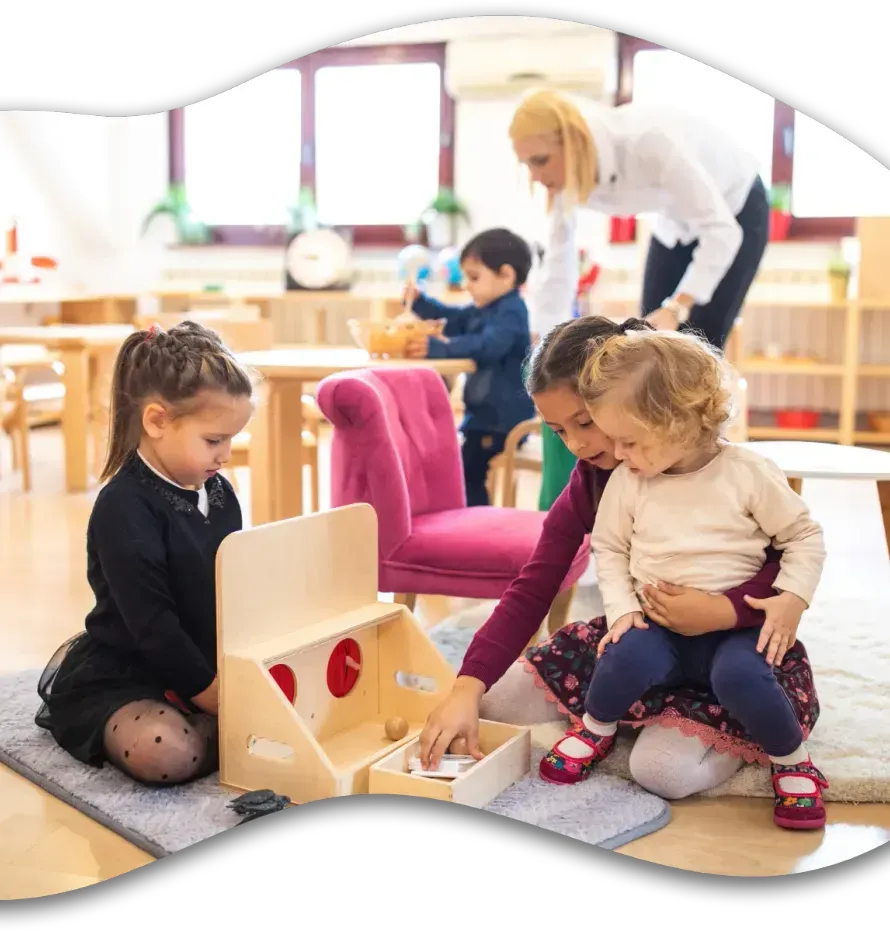 A group of children are playing with toys in a classroom.