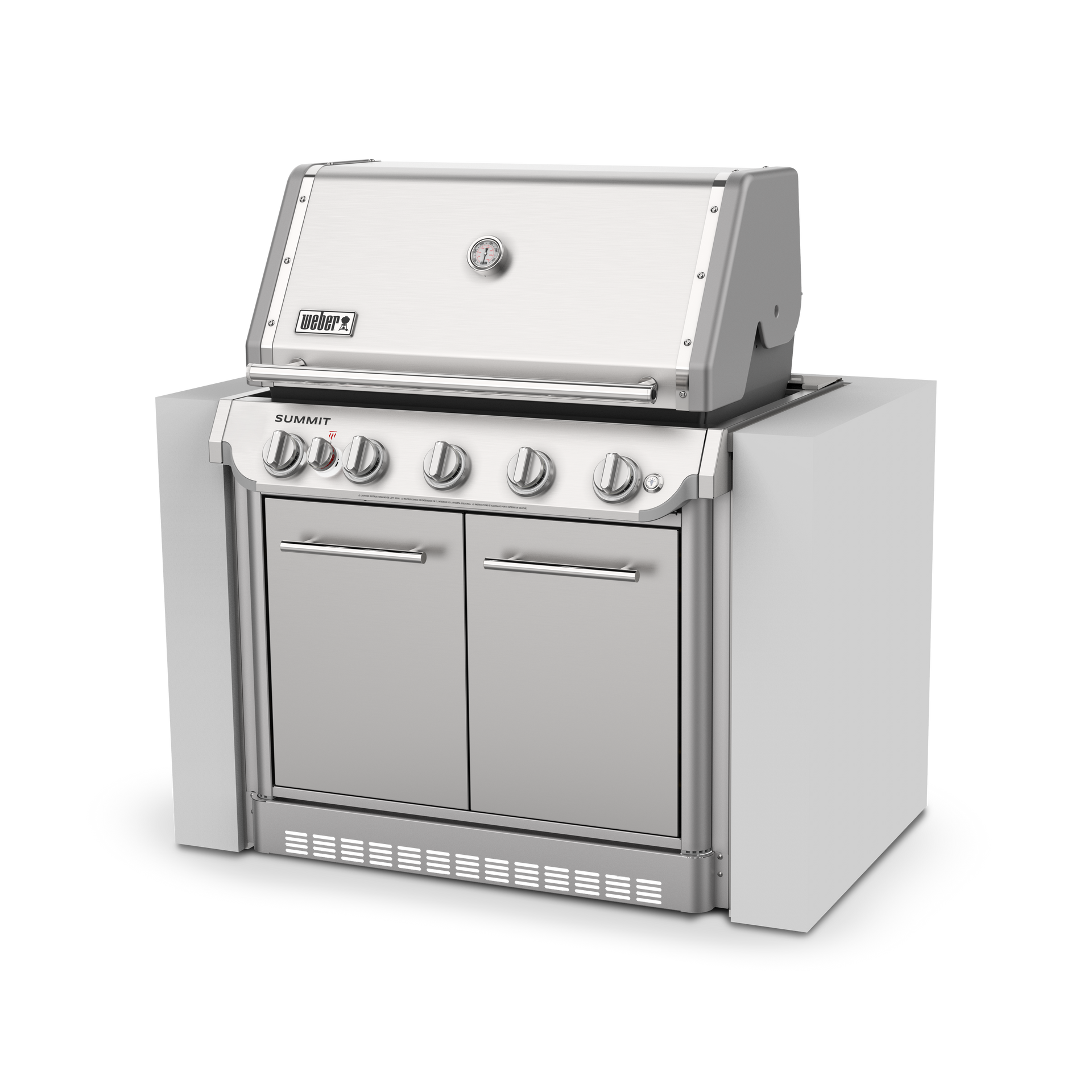 A stainless steel grill is sitting on top of a white counter.