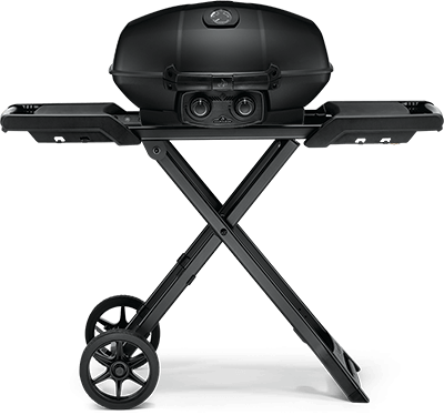 A black grill is sitting on top of a folding stand with wheels.