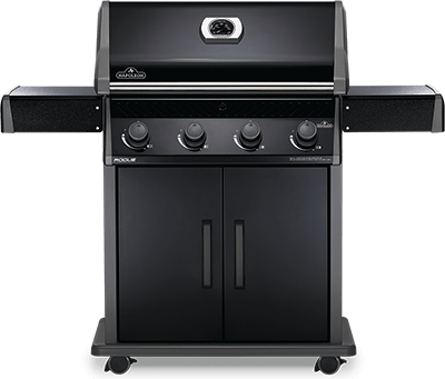 A black gas grill is sitting on top of a white table.