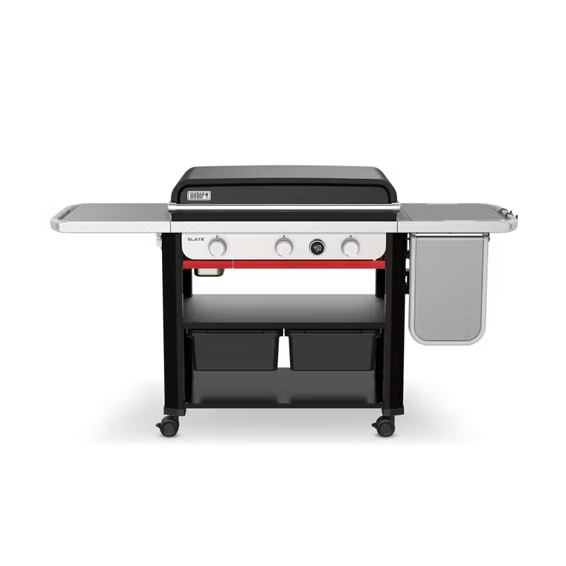 A weber grill is sitting on top of a cart on a white background.