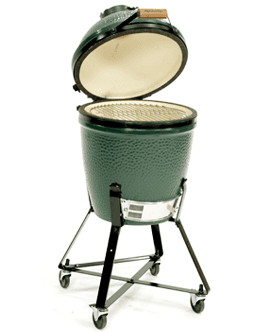 A green egg shaped grill with the lid open