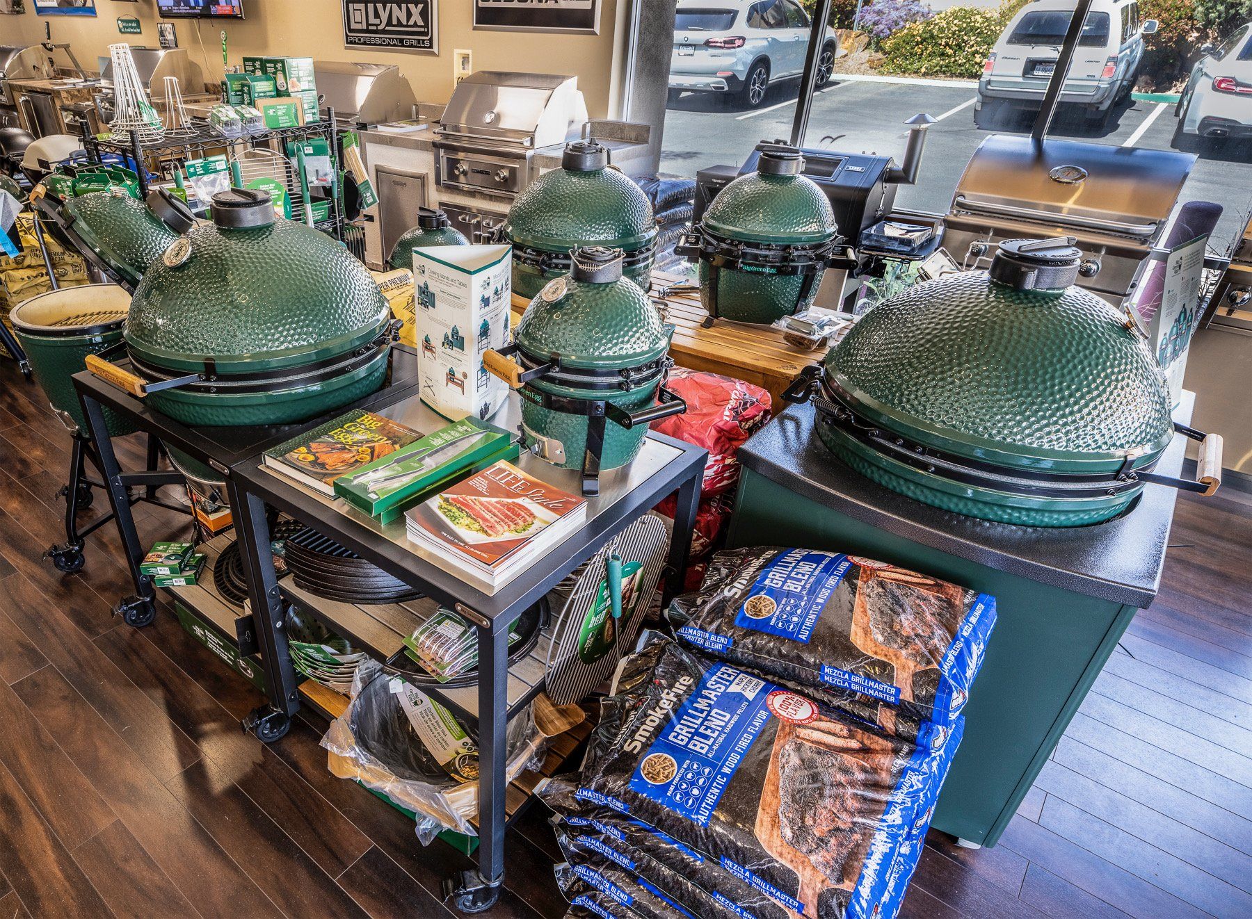 a bunch of big green egg grills are on display in a store