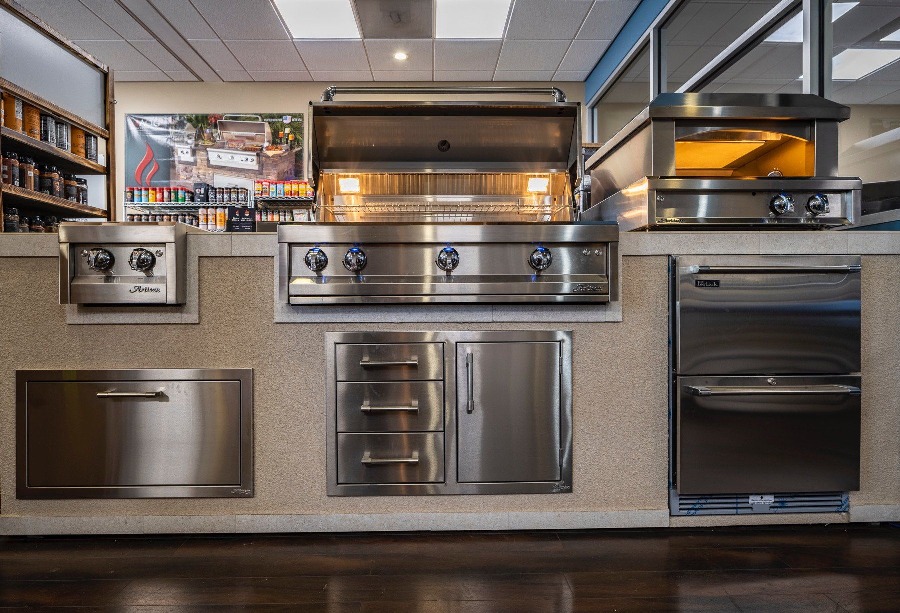 a kitchen with stainless steel grills and granite counter tops