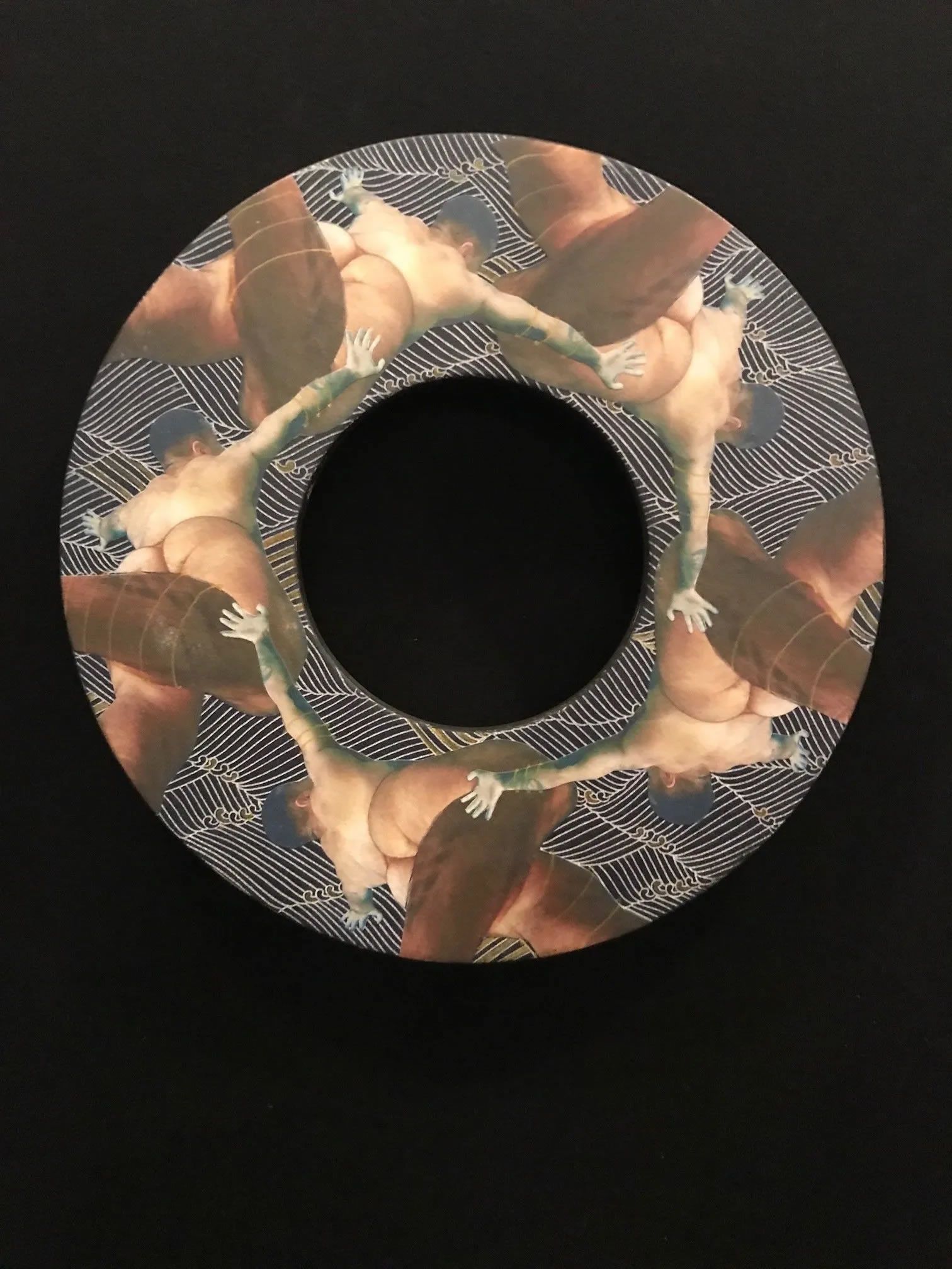 Circular artwork with a repeating pattern of hands and arms in a patterned background.