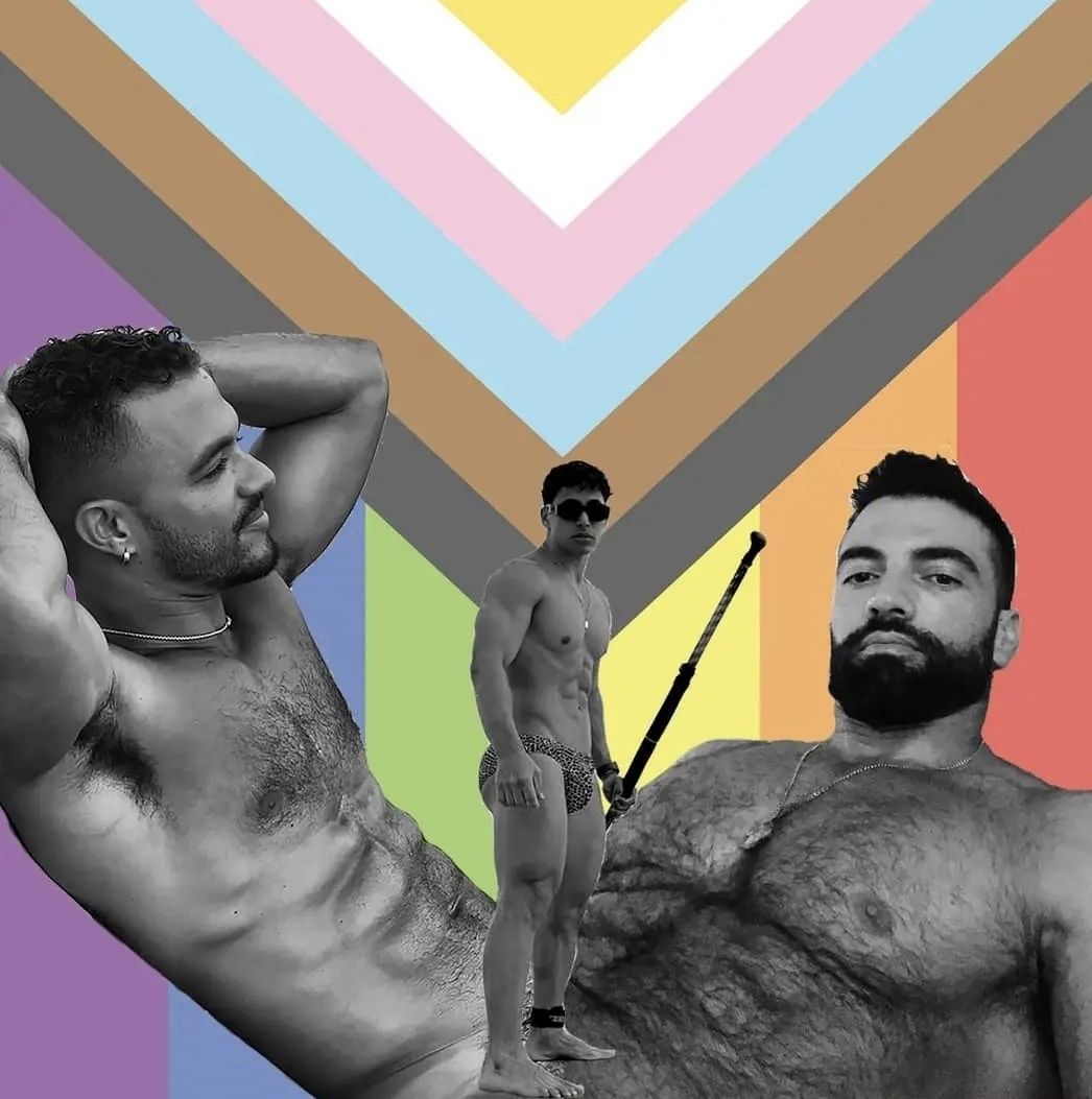 Three shirtless men in front of a Pride flag; two are black and white.