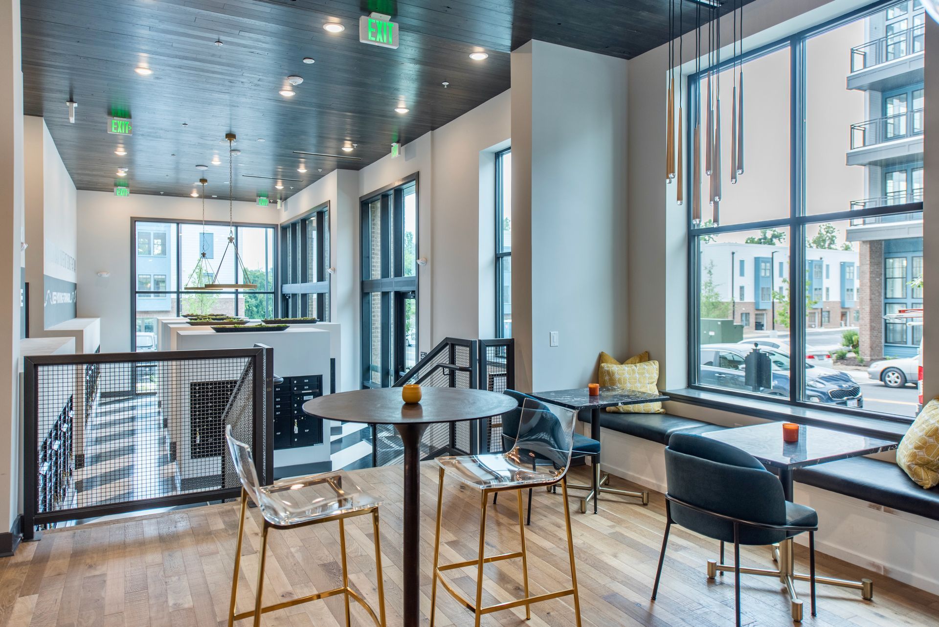 Clubhouse with tables and chairs and a clock on the wall.