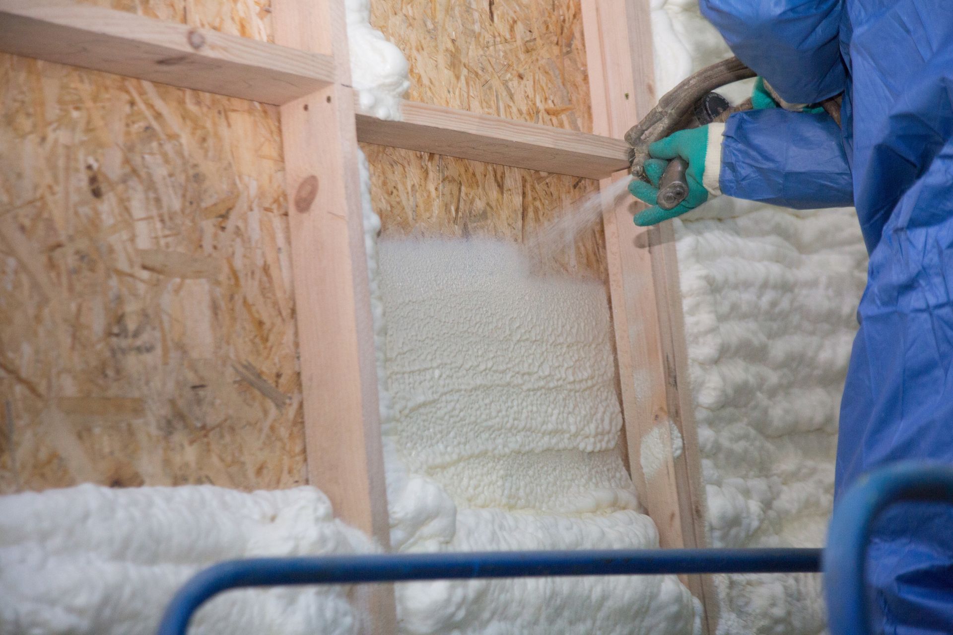 A Man In A Blue Suit Adding A Foam Insulation – Genoa, WI – Finney Foam