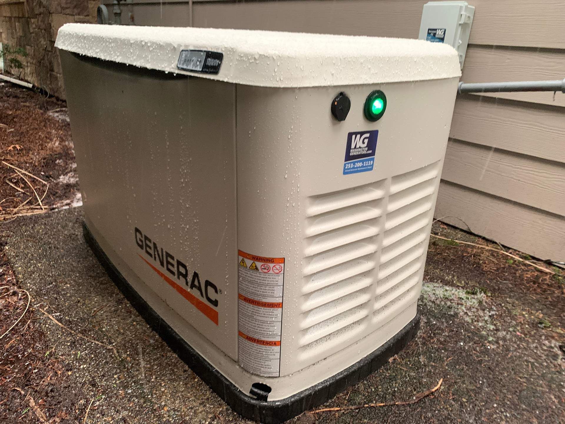 A generator is sitting on the side of a house.