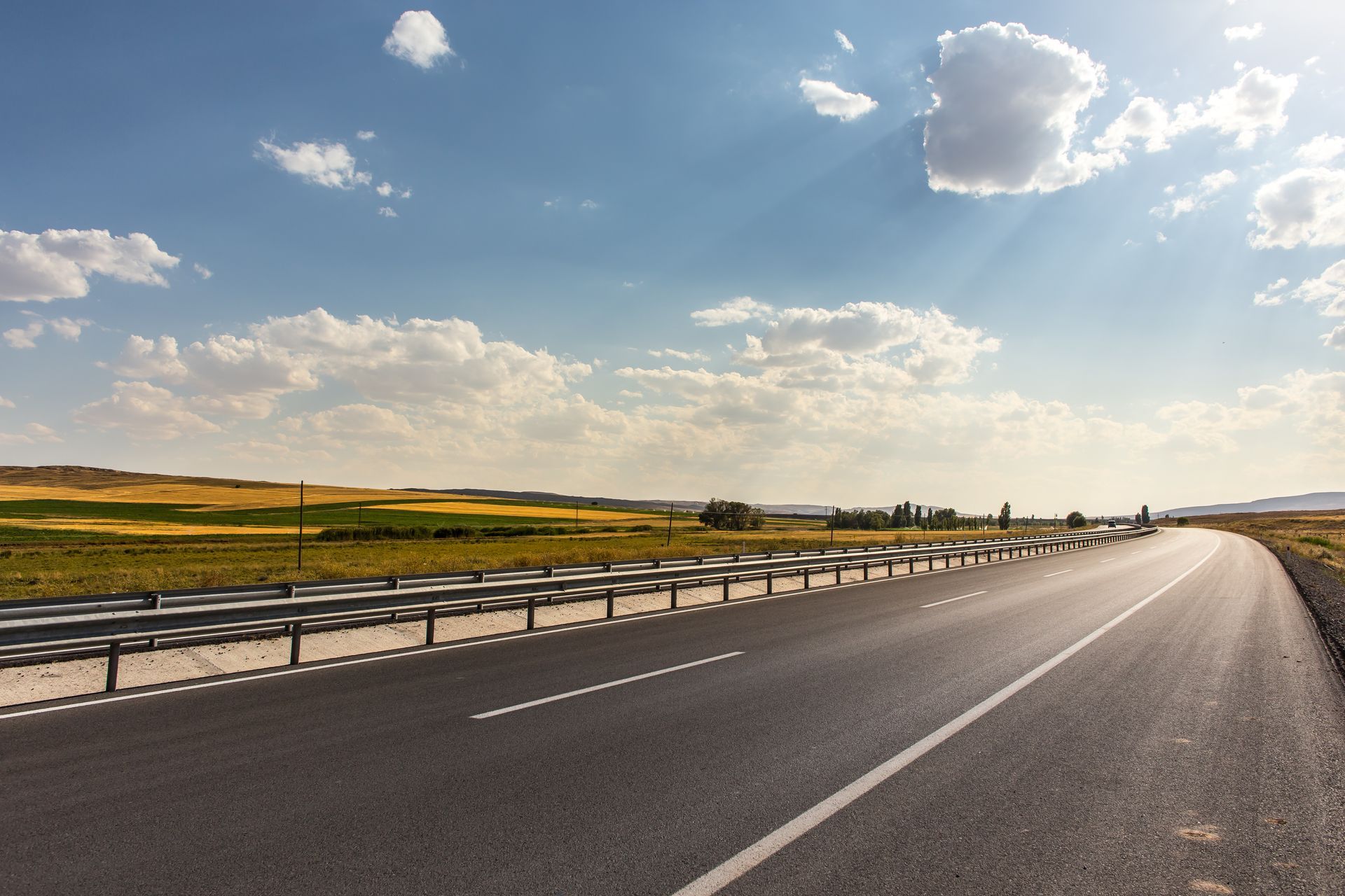 Aerial close-up of an empty motorway with fresh line markings.