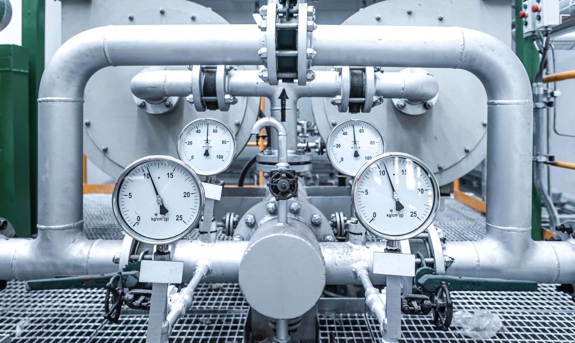 Industrial machinery with pipes, gauges, and valves.