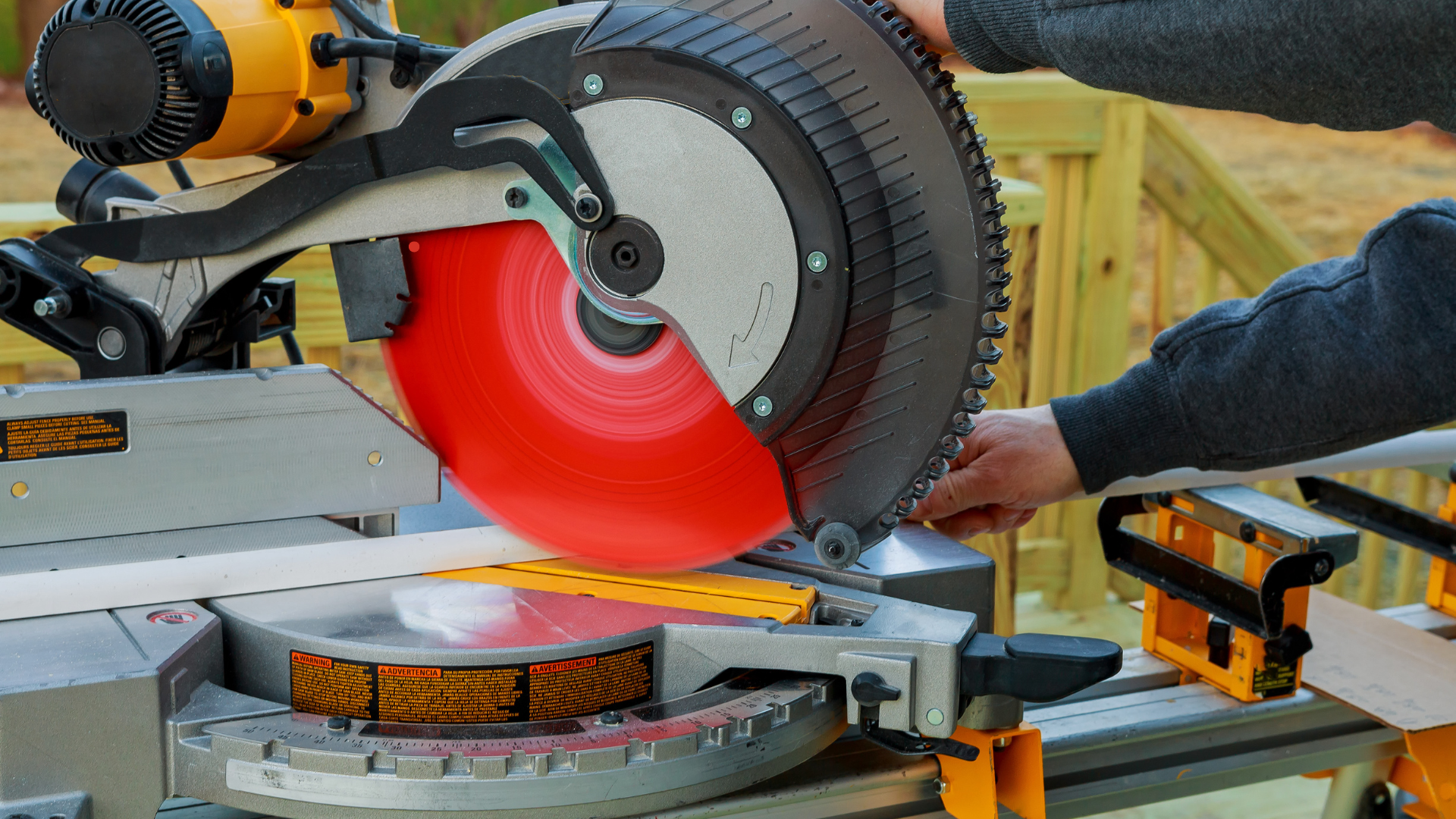 Laser cutting metal sheet with glowing sparks in an industrial workshop