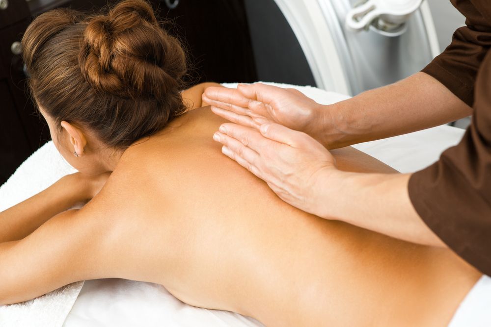 A Woman is Getting a Massage on Her Back at a Spa — Kerry's Body Therapy in Millner, NT
