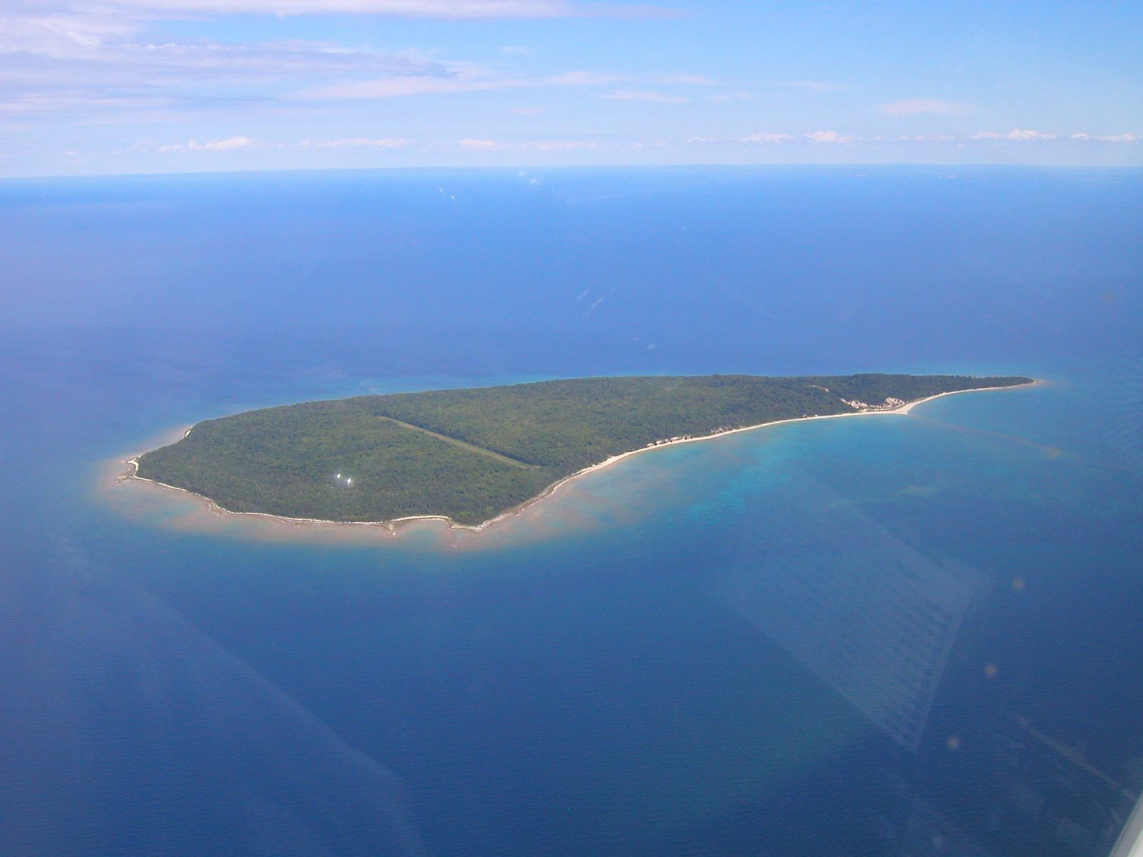 An aerial view of a small island in the middle of the ocean