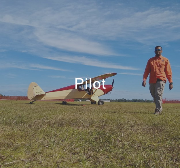 A man walking in a field with a plane in the background and the word pilot on the bottom