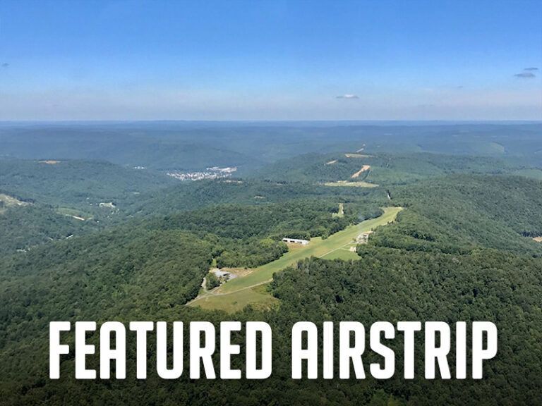 An aerial view of a forest with the words featured airstrip below it