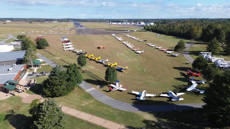 An aerial view of a field with a lot of planes on it