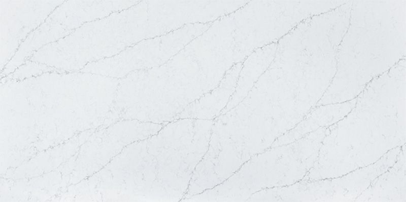 A close up of a white marble counter top.
