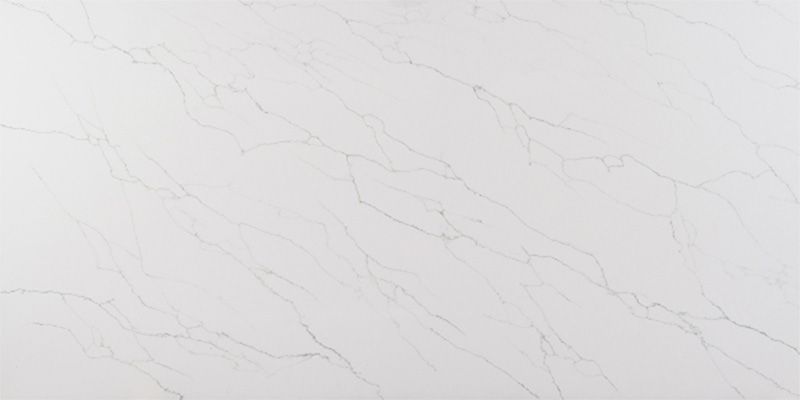 A close up of a white marble counter top.