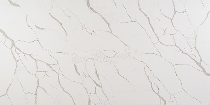 A close up of a white marble counter top.
