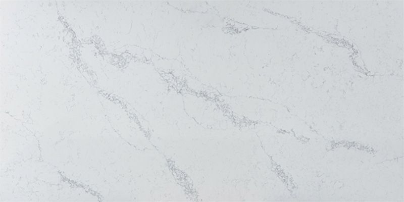A close up of a white marble counter top.