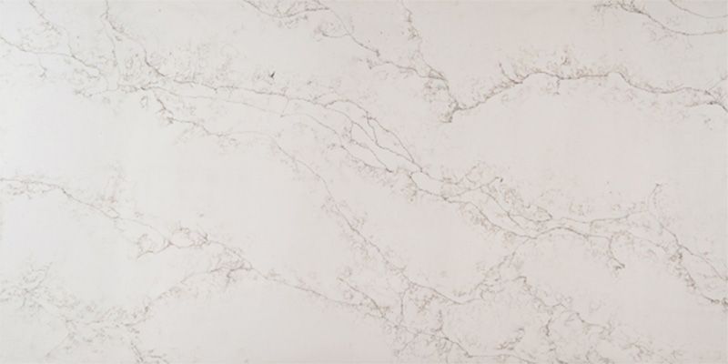 A close up of a white marble counter top.