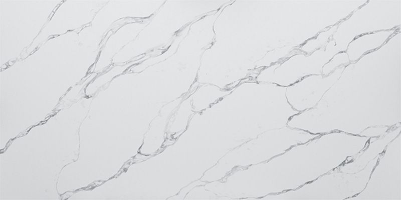 A close up of a white marble counter top.