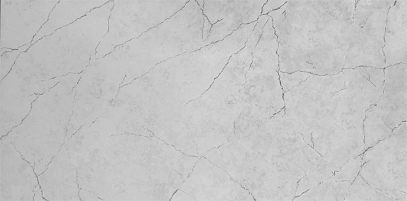 A close up of a white marble slab with a cracked texture.