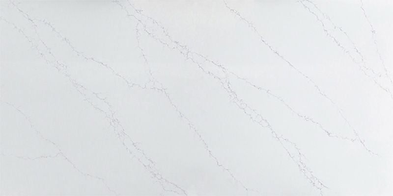 A close up of a white marble counter top.