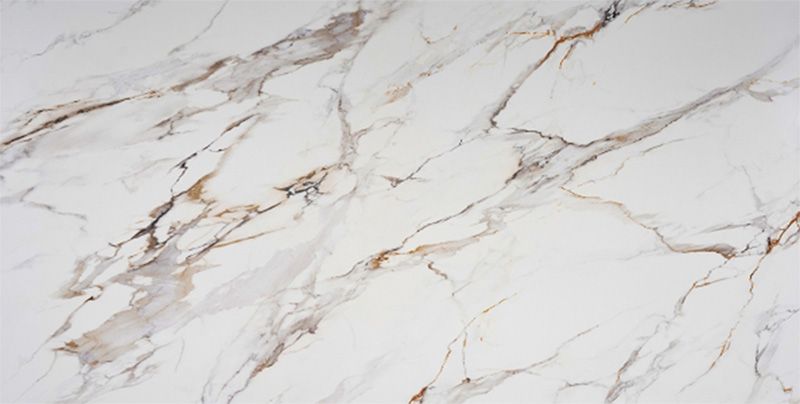 A close up of a white and gold marble texture.