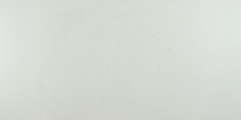 A close up of a white tile with a grainy texture.