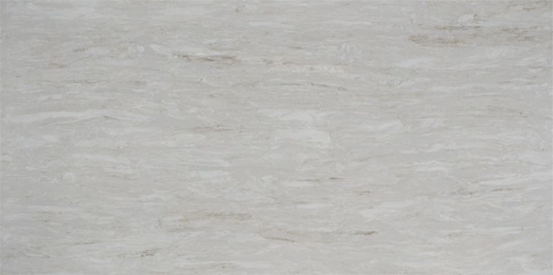 A close up of a white tile with a marble texture.