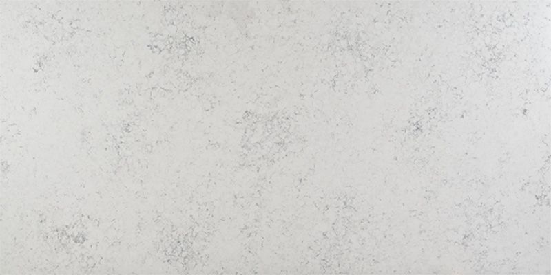 A close up of a white granite counter top.