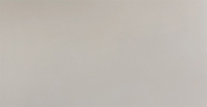 A close up of a white tile with a plain texture.