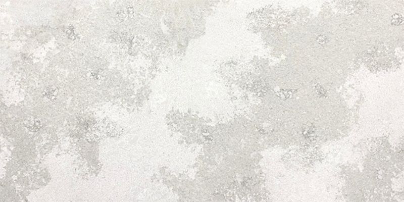 A close up of a white tile with a marble texture.