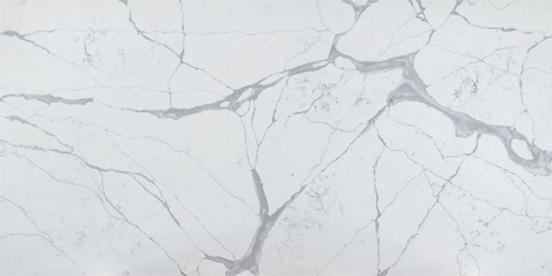 A close up of a white marble counter top.