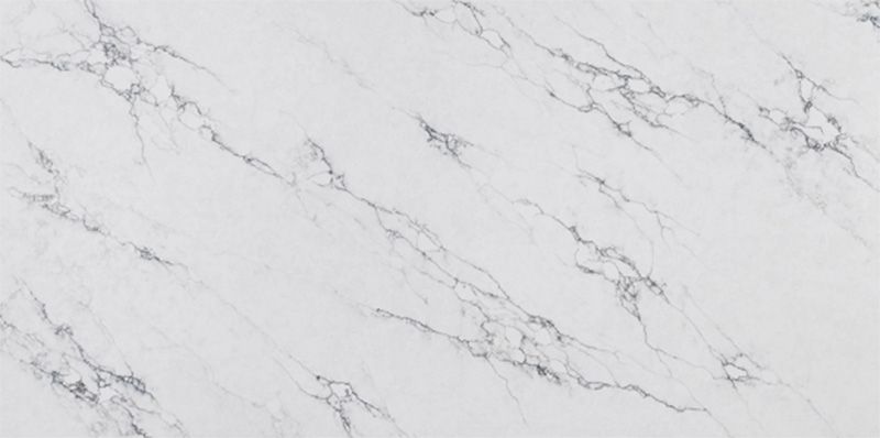 A close up of a white marble counter top.