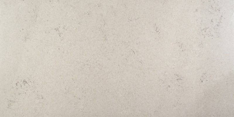 A close up of a white granite counter top.