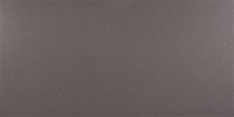 A close up of a gray tile with a plain texture.