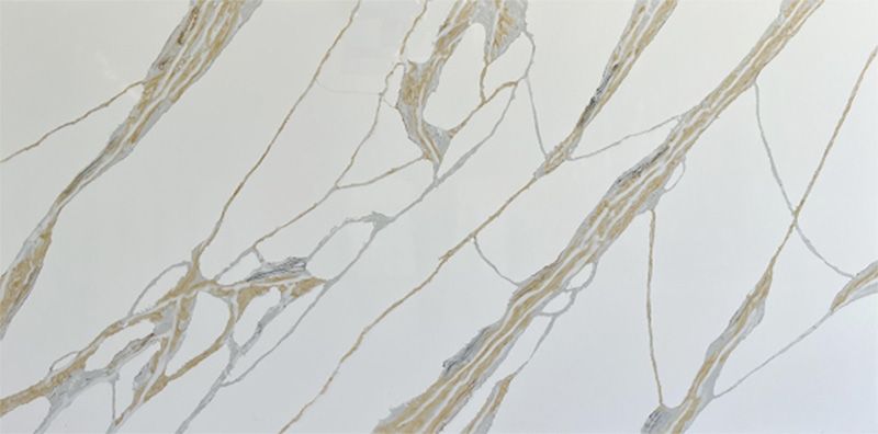 A close up of a white and gold marble slab.