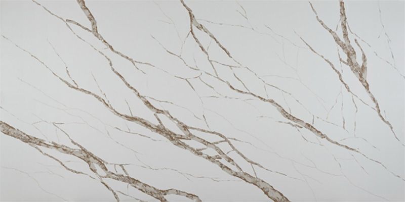 A close up of a white marble counter top with brown veins.