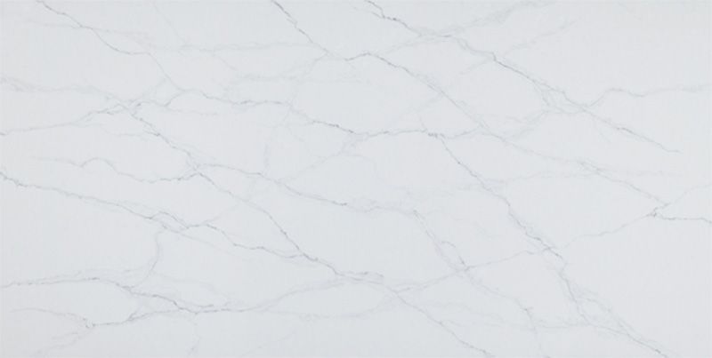 A close up of a white marble counter top.