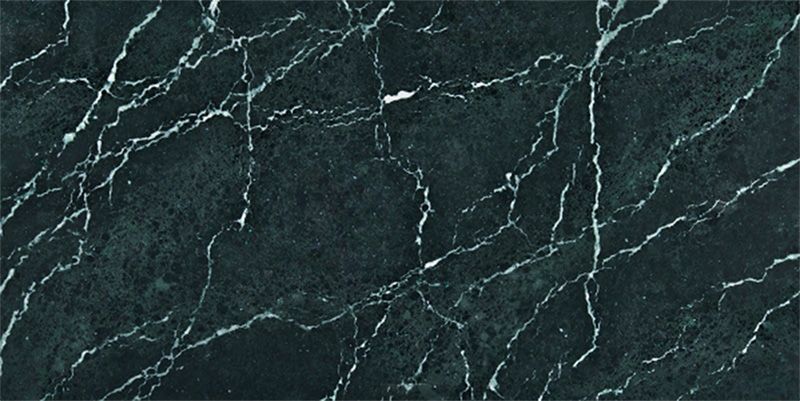 A close up of a black marble slab with white veins