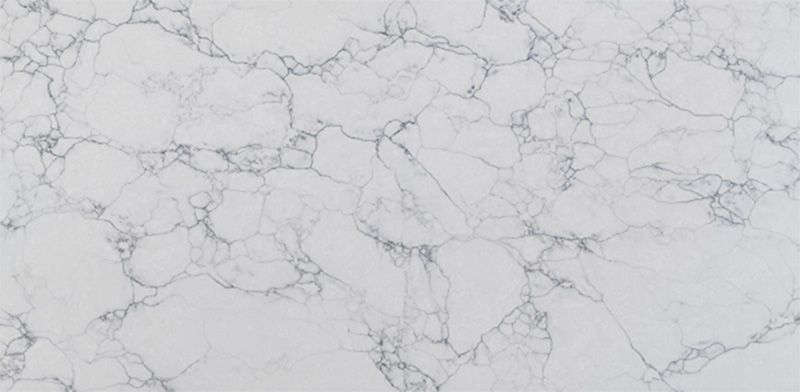 A close up of a white marble counter top.