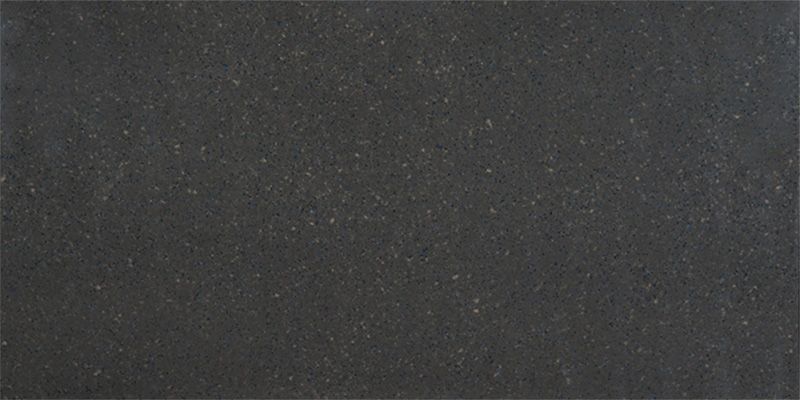 A close up of a black granite counter top.