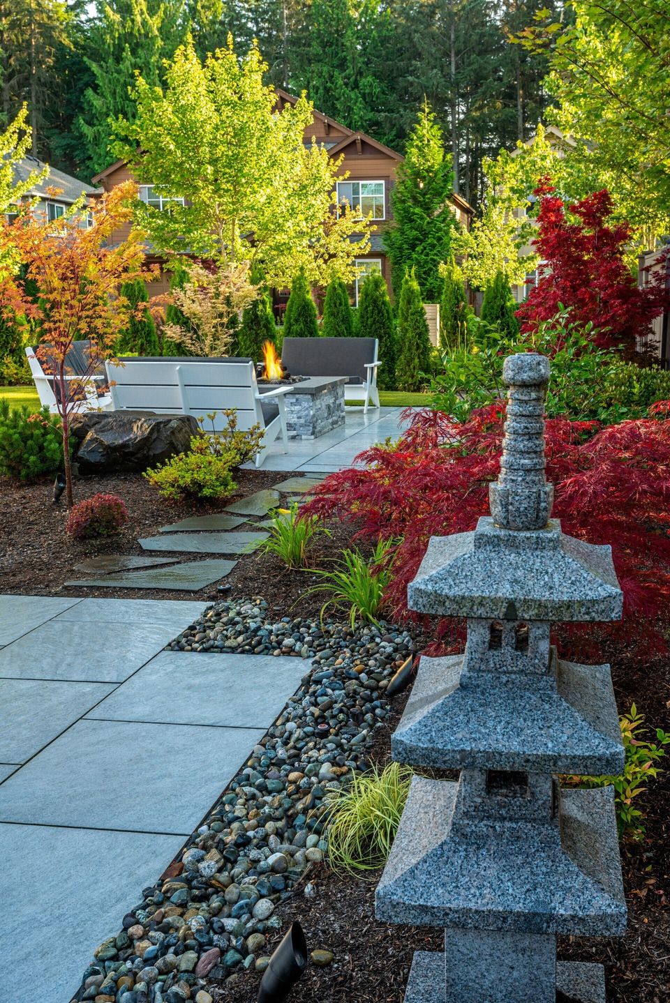 Asian-infused outdoor resort with fire pit